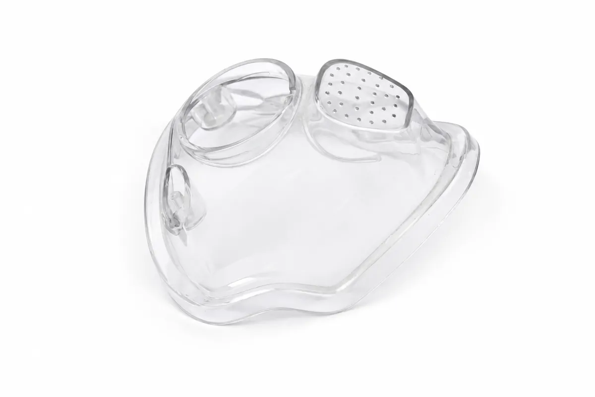 Transparent SLA-style printed prototype with detailed openings and formed surfaces.