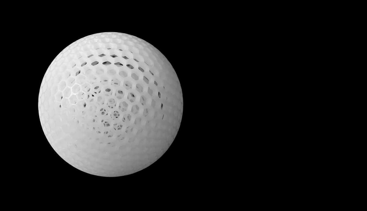 White polymer lattice sphere showing open interconnected geometry as a powder-bed design reference.