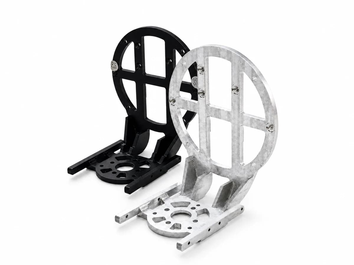 Prismatic CNC-milled black and aluminum assemblies