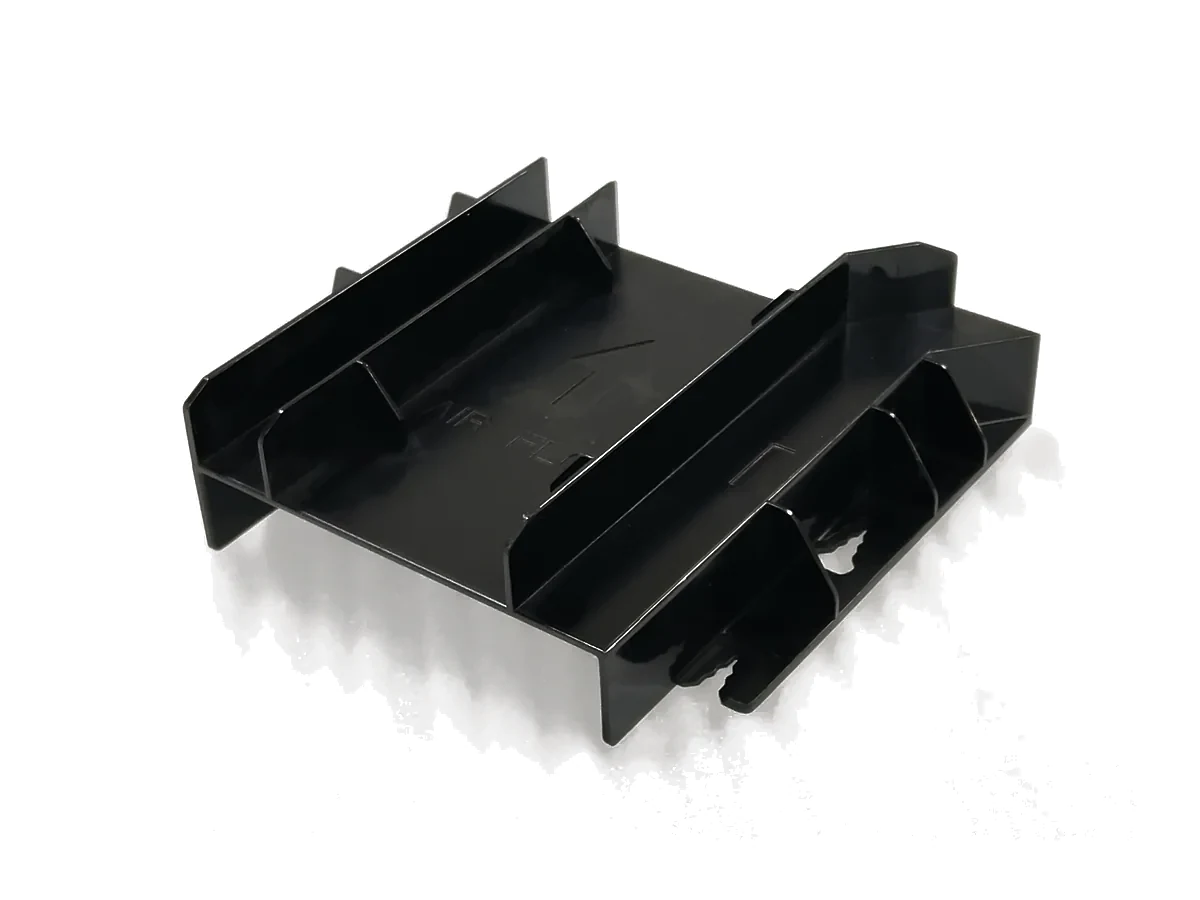 Black injection-molded structural component with reinforcement ribs