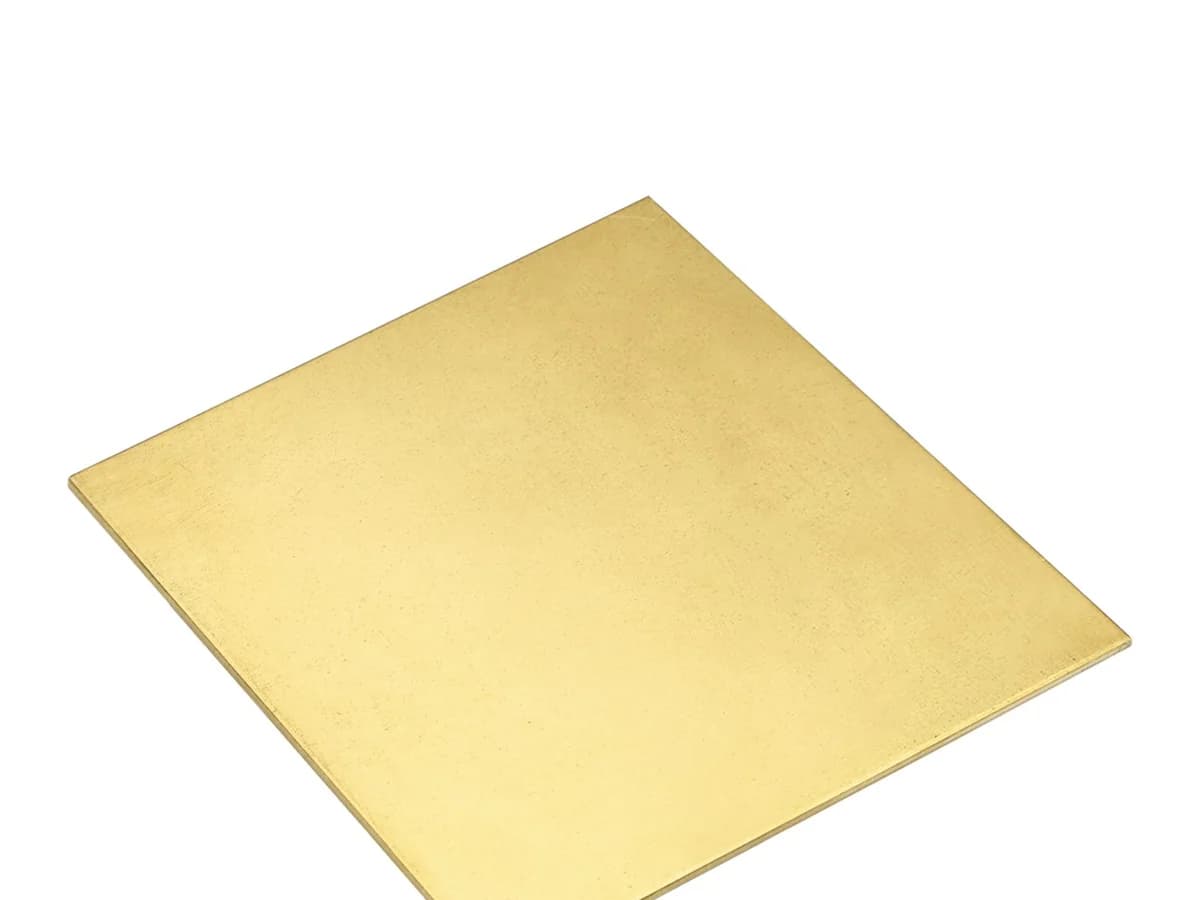 Flat sheet of H62 brass on a white background